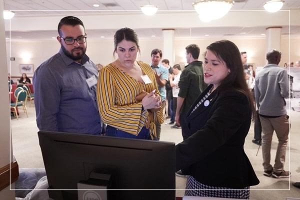 Professionals looking at a computer screen